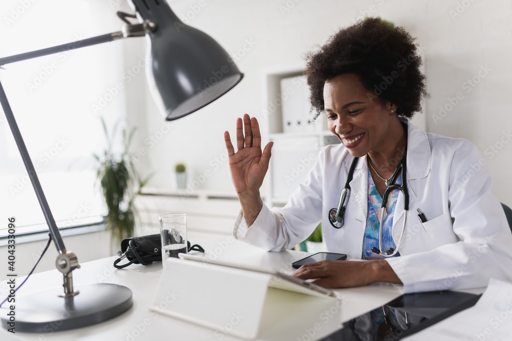 Doctor greeting a patient during a telehealth appointment