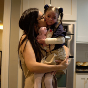 Jessica holding her daughter, a ZEVASKYN-treated patient